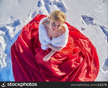 girl in red dress. Forest in winter