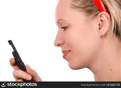 Girl in red hair band with mobile phone on white