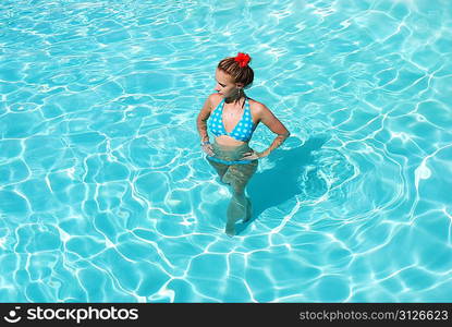 Girl in resort swimming pool