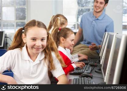 Girl in school class smiling to camera
