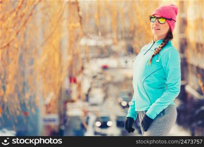 Girl in shape working out. Exercising in winter park. Health fitness nature fashion concept. . Girl in shape working out