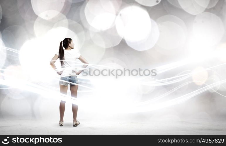 Girl in shorts. Rear view of young girl in denim shorts