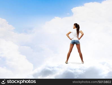 Girl in shorts. Rear view of young girl in denim shorts