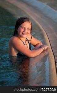Girl in swimming pool in Kenya