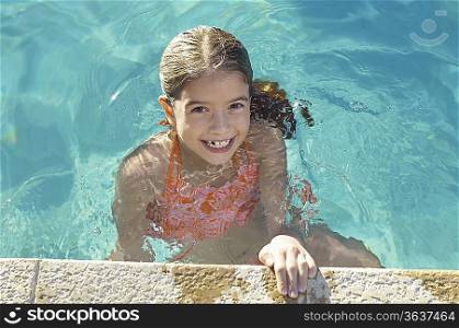 Girl in swimming pool, portrait