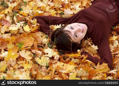 Girl in the autumn leafs. Element of design.
