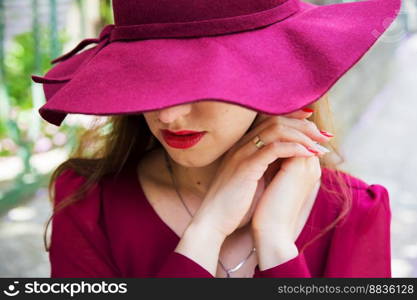 girl in the hat, red dress, hands close-up. girl in the hat, red dress