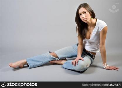 girl in torn jeans and a light T-shirt