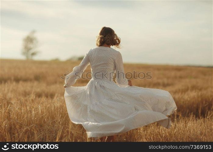 girl in white dress fall outside
