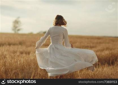 girl in white dress fall outside