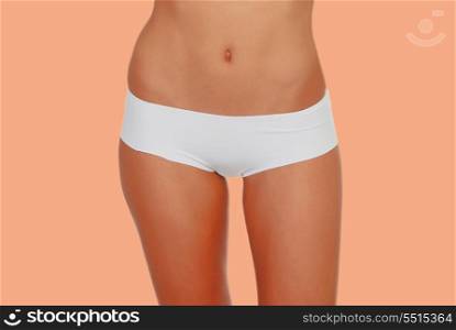 Girl in white underwear o a orange background