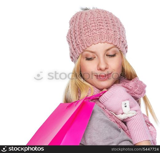 Girl in winter clothes with christmas shopping bag