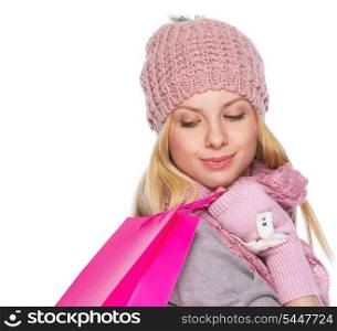 Girl in winter clothes with christmas shopping bag