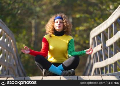 Girl in yoga pose in the park