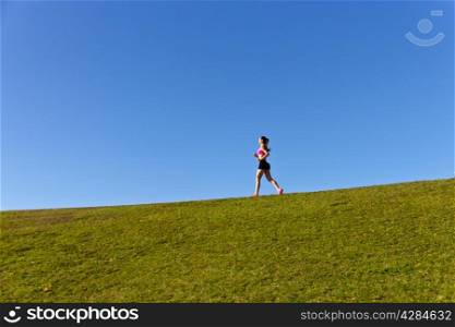Girl jogging on a summer day