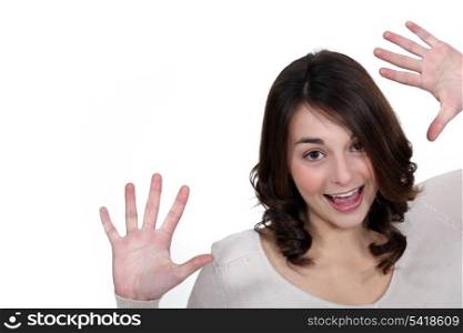 girl laughing and raising hands