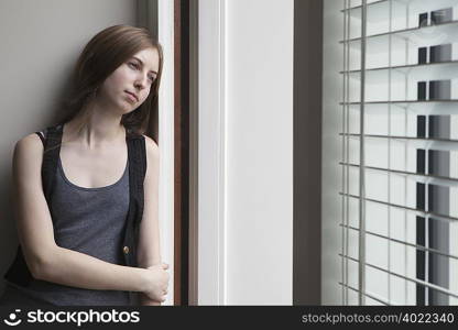 Girl leaning against wall