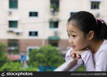 Girl leaning on a railing