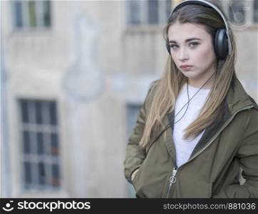 Girl listening music and looking at you