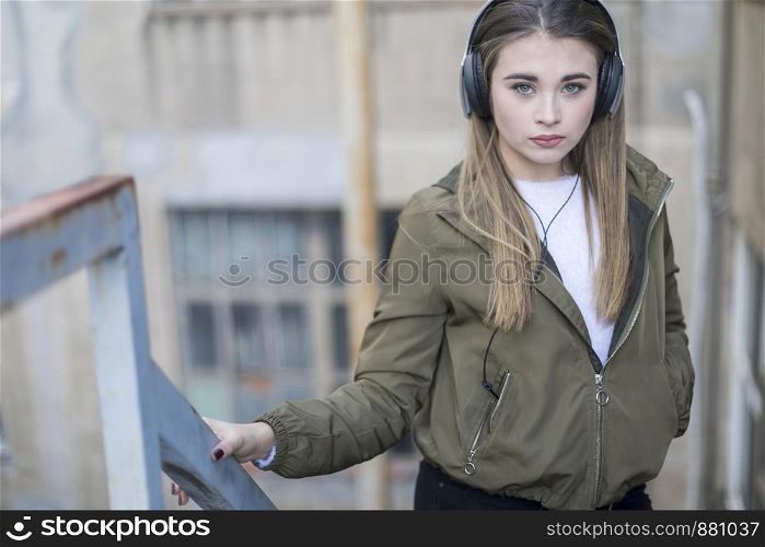 Girl listening music and looking at you