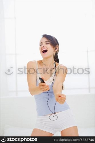 Girl listening music in bedroom