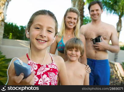 Girl Listening to iPod Standing with Family