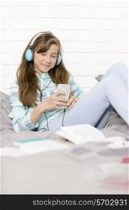 Girl listening to music at home