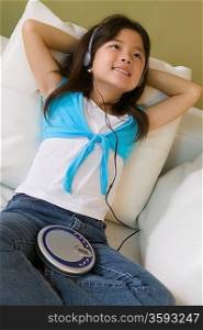 Girl Listening to Music on Portable CD Player