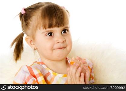 Girl looking up clapping hands isolated on white