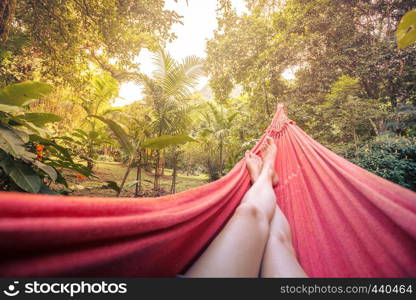 girl lying in a hammock in the tropical jungles of Brazil. Brasil