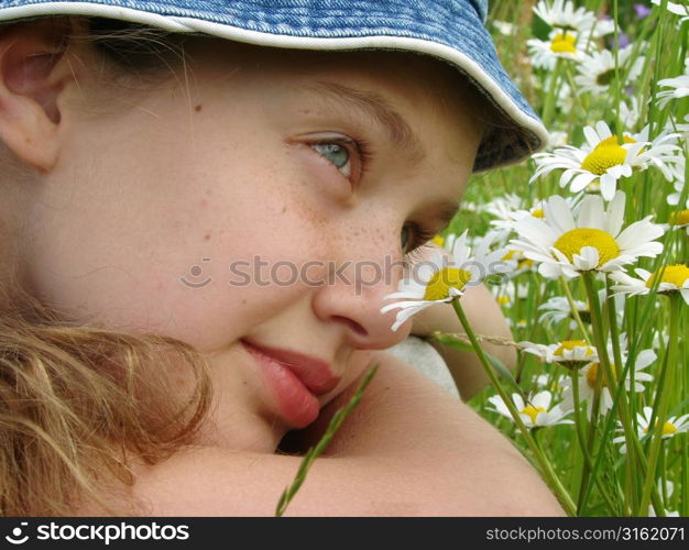 Girl lying in daisies