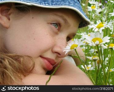 Girl lying in daisies
