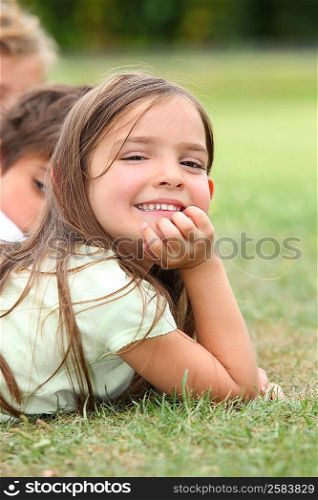 Girl lying in the grass