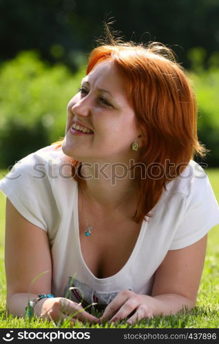 girl lying on a grass at the park