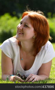 girl lying on a grass at the park