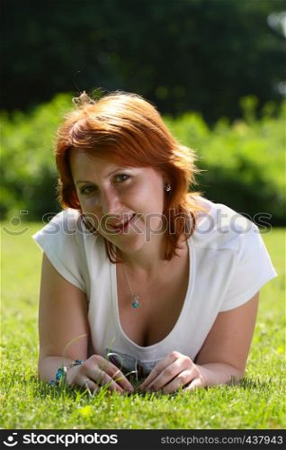 girl lying on a grass at the park