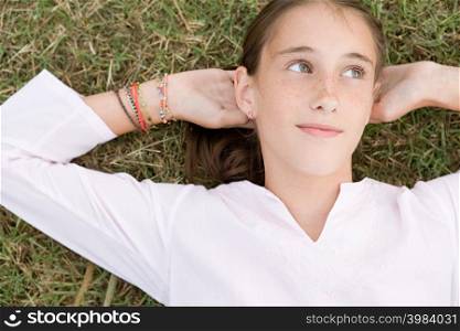 Girl lying on grass