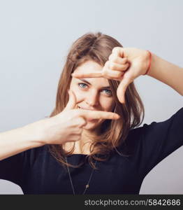 girl makes a frame arms