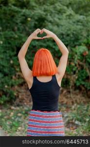 Girl making a heart shape symbol for love