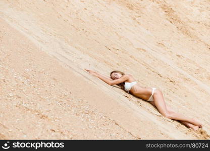 girl model on a sandy career on a diagonal frame