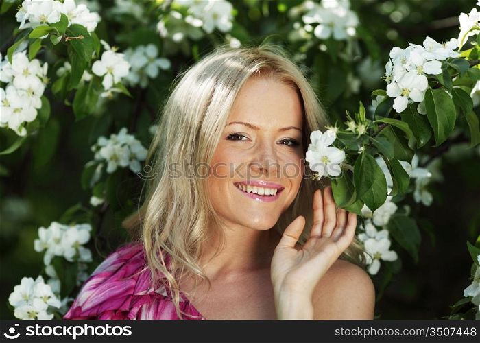 girl on a background of white flowers