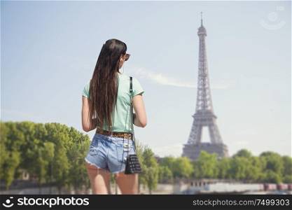 girl on a eiffel tower background. Retro film style