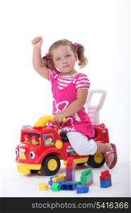 Girl on a toy car