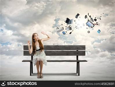 Girl on bench. Young pretty scared asian woman sitting on bench