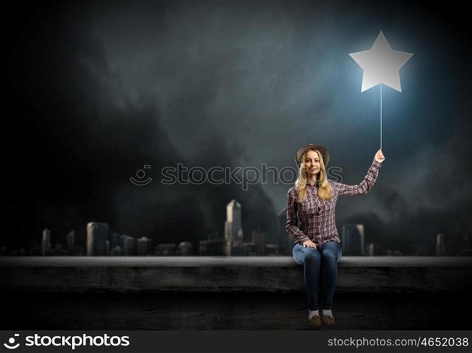 Girl on bench. Young teenager girl sitting on bench with balloon in hand