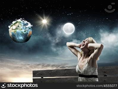 Girl on bench. Young woman sitting on bench closing ears with palms and screaming. Elements of this image are furnished by NASA