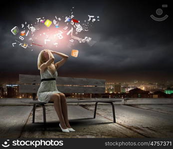 Girl on bench. Young woman sitting on bench closing eyes with palms