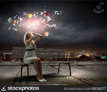 Girl on bench. Young woman sitting on bench closing eyes with palms