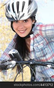 girl on bike with safety helmet