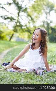 girl on blanket smiling